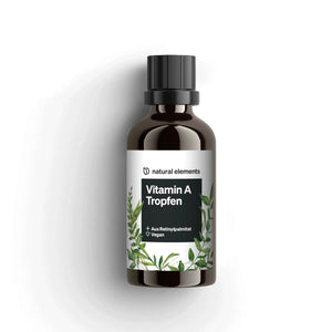 Una botella marrón de diseño minimalista con tapa negra y acentos de hojas verdes lleva la inscripción 'NATURAL ELEMENTS Gotas de Vitamina A', con una fórmula vegana enriquecida con aceite de MCT.