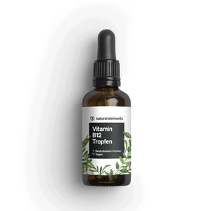 Una botella de gotas de vitamina B12 de NATURAL ELEMENTS con un tapón cuentagotas negro y una etiqueta blanca con un diseño de hojas verdes.